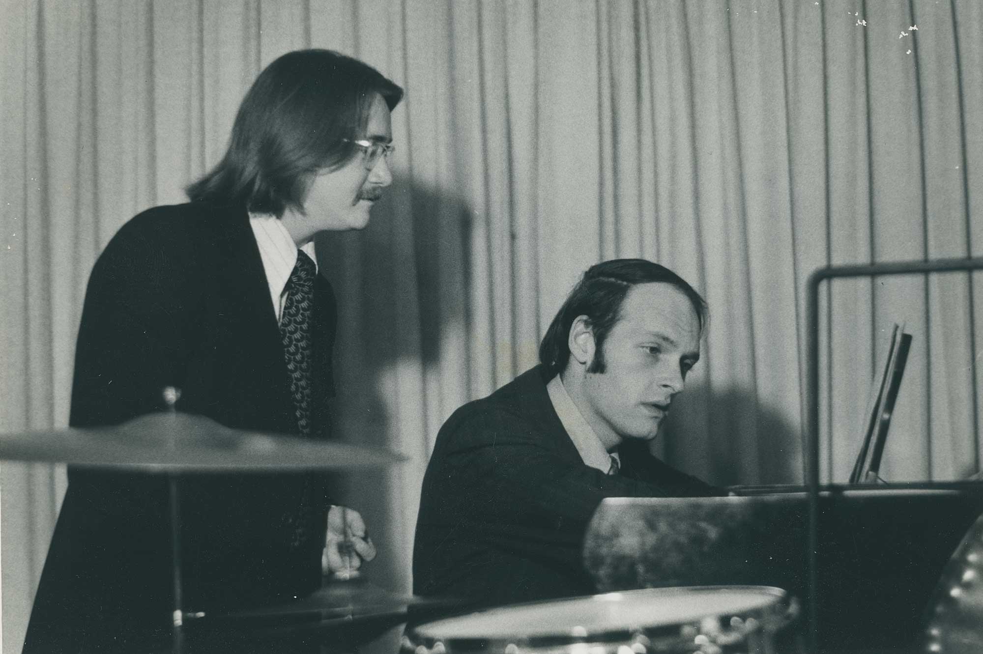 Jerry Hunt and Ronald Snider at a piano.