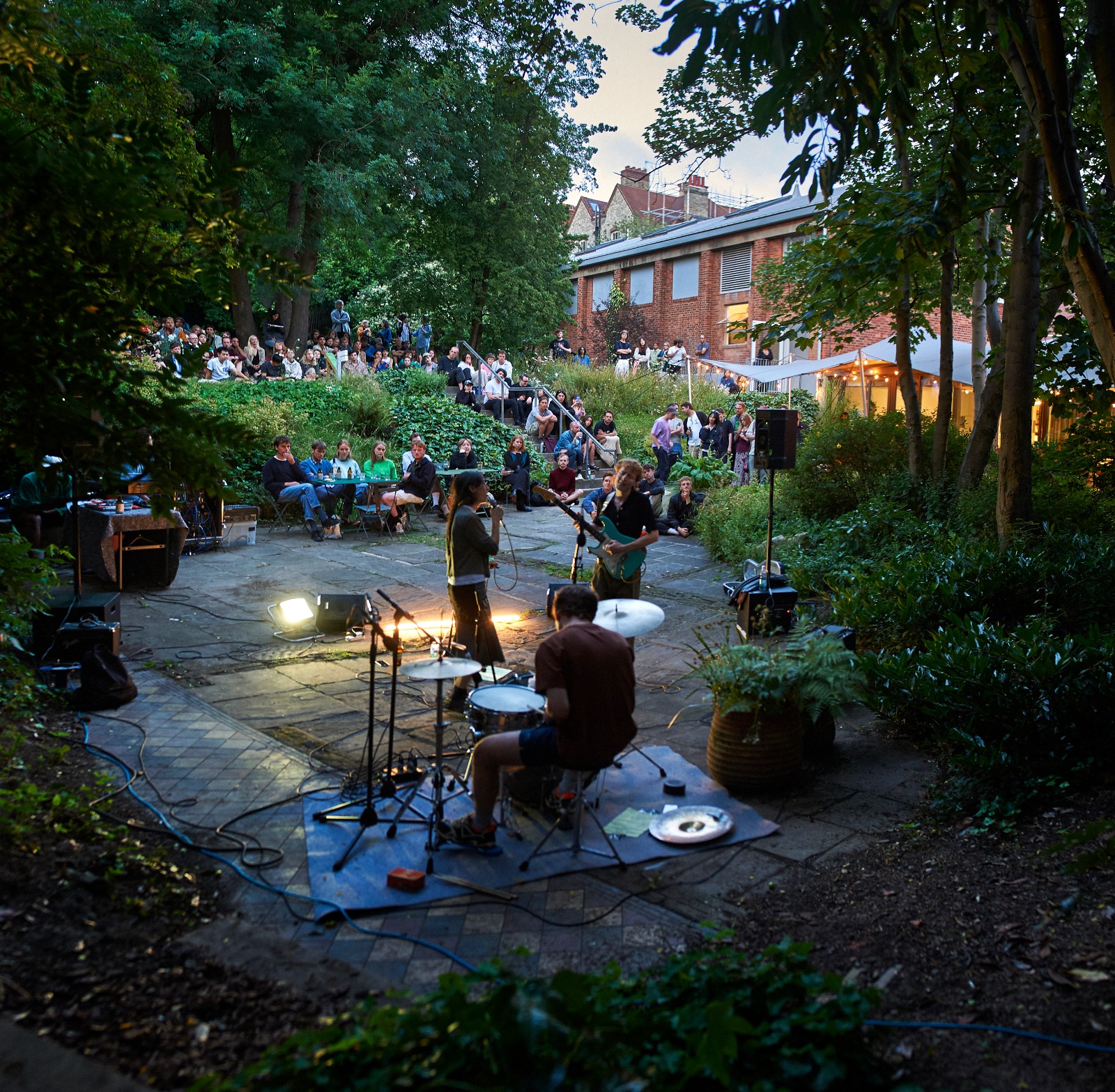 Band playing outside with a crowd