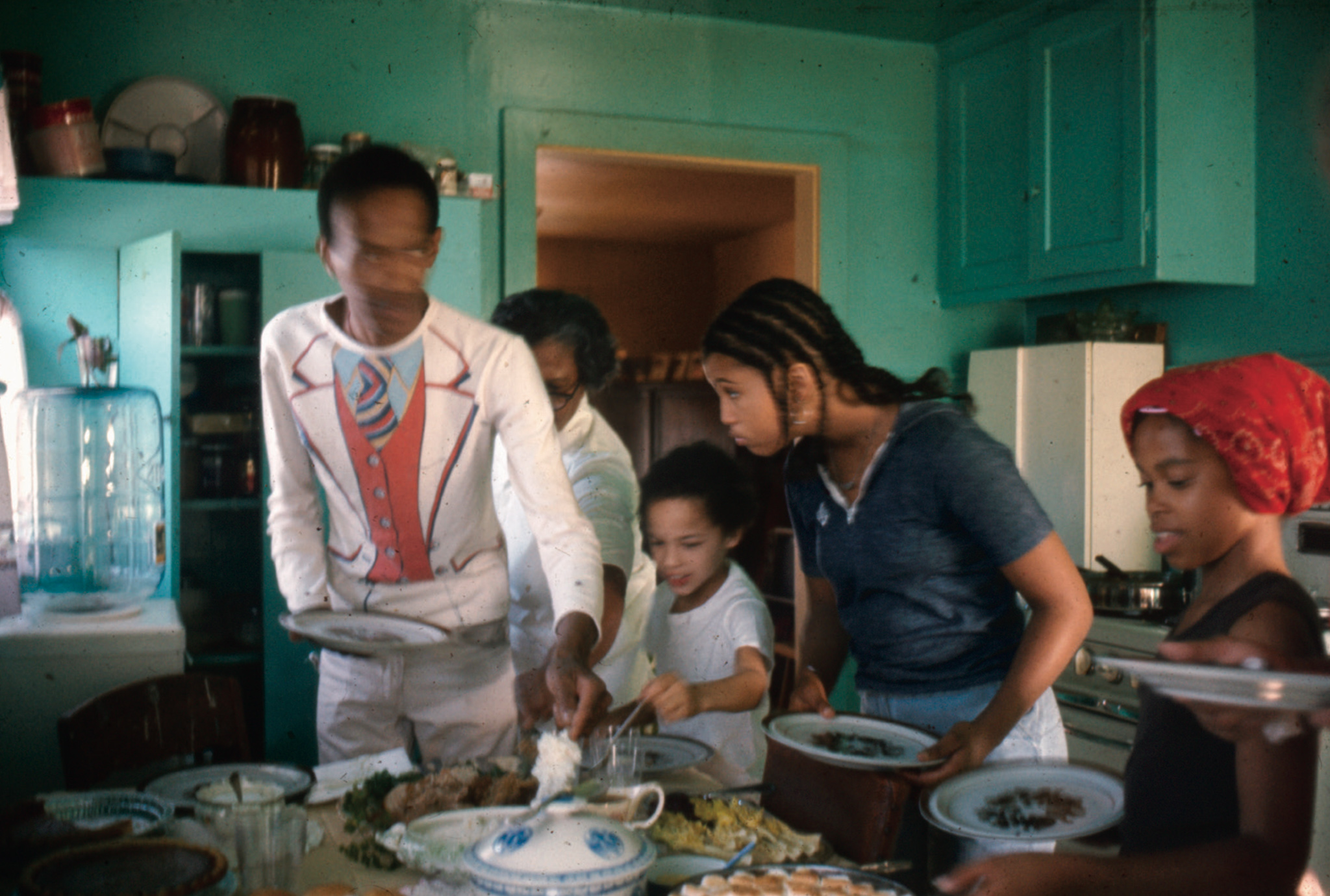 Don Cherry at Daisy Cherry’s house in Watts, Los Angeles, California, ca. 1976. Left to right: Don Cherry, Daisy Cherry, Eagle-Eye Cherry, Neneh Cherry, Lisa Lawrence.