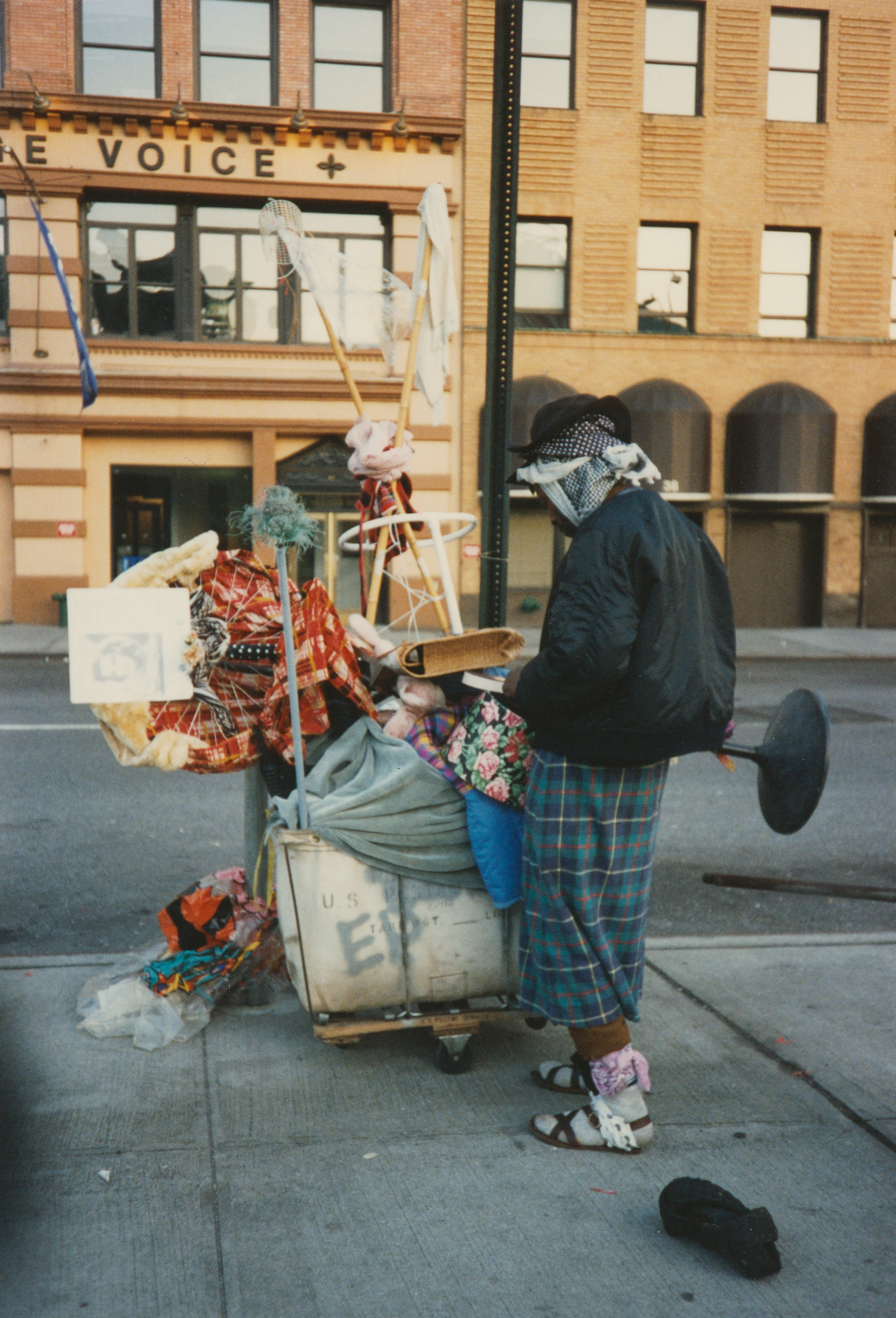 Cuffie organizing sculpture materials in his cart. 